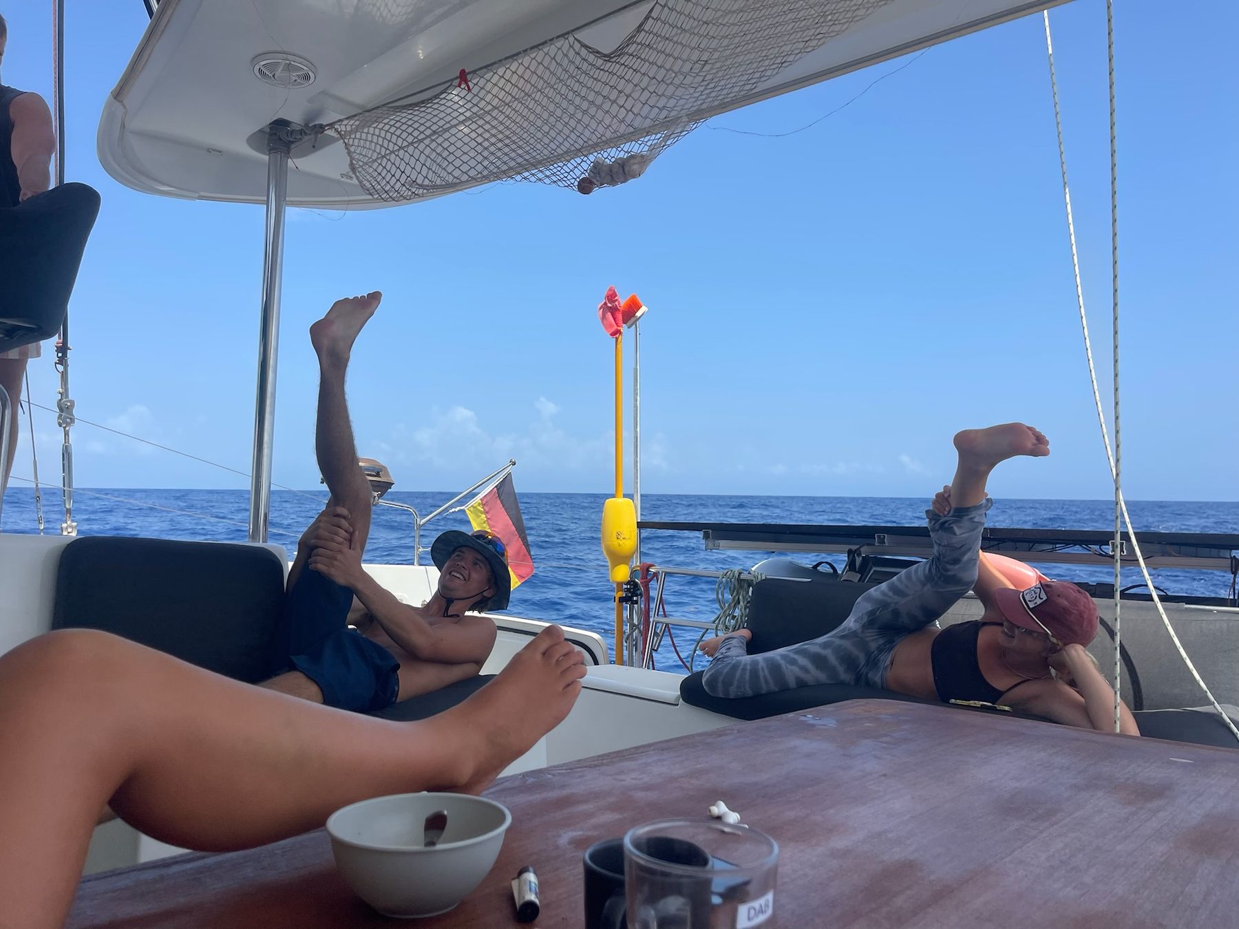 Crew stretching and lounging in the cockpit underway