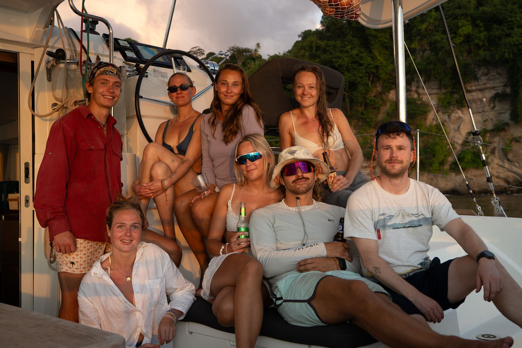 Crew group photo in the cockpit at sunset